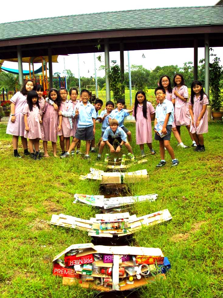 Children at Tunku Putra School in Kuching Malaysia test the strenght of their bridge designs during the IPC Investigating Rivers unit 1