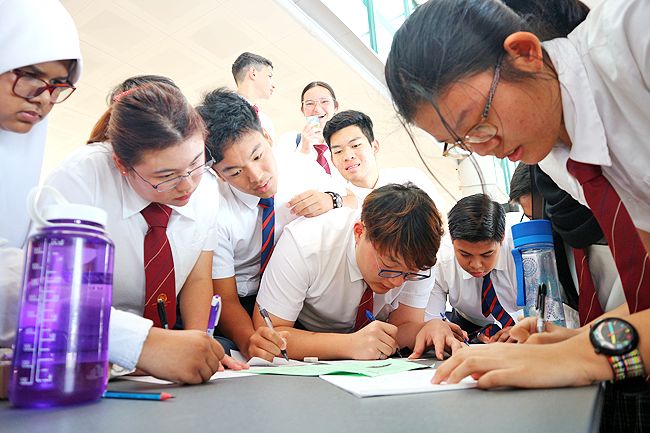 Students of Jerudong International School (JIS) engaging in written activities during their maths week